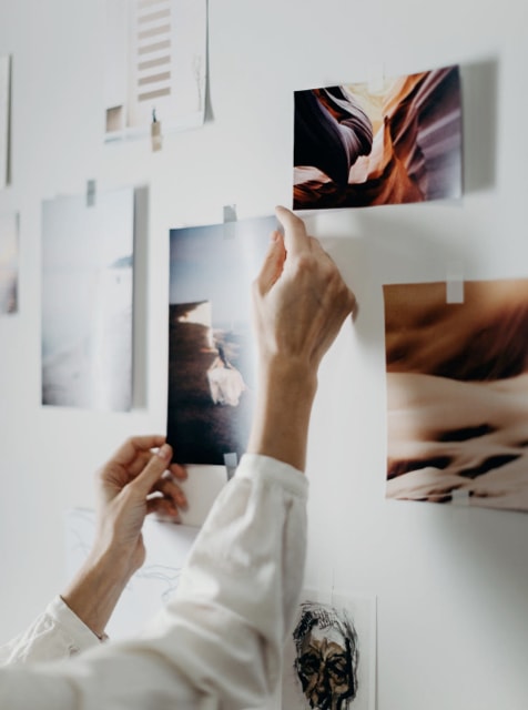 Woman's hands touching photograph